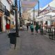 Calle de Marchena con terrazas y comercios, septiembre de 2026